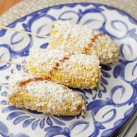 Elotes · Gluten-free. Mexican street corn, grilled with cotija cheese, chipotle aioli, Rocco’s spice.