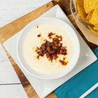 Queso Dip · Add chorizo or ground beef for an additional charge.