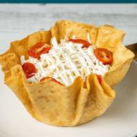 Taco Salad · Crispy flour tortilla with ground beef or shredded chicken, refried beans, lettuce, tomatoes...