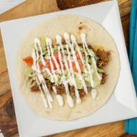 The American Taco · Ground beef or shredded chicken, lettuce, tomatoes, sour cream and queso fresco. Substitute ...