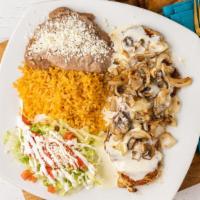 Pollo Ranchero · Grilled chicken breast topped with grilled mushrooms, onions and tomatoes with cheese dip on...