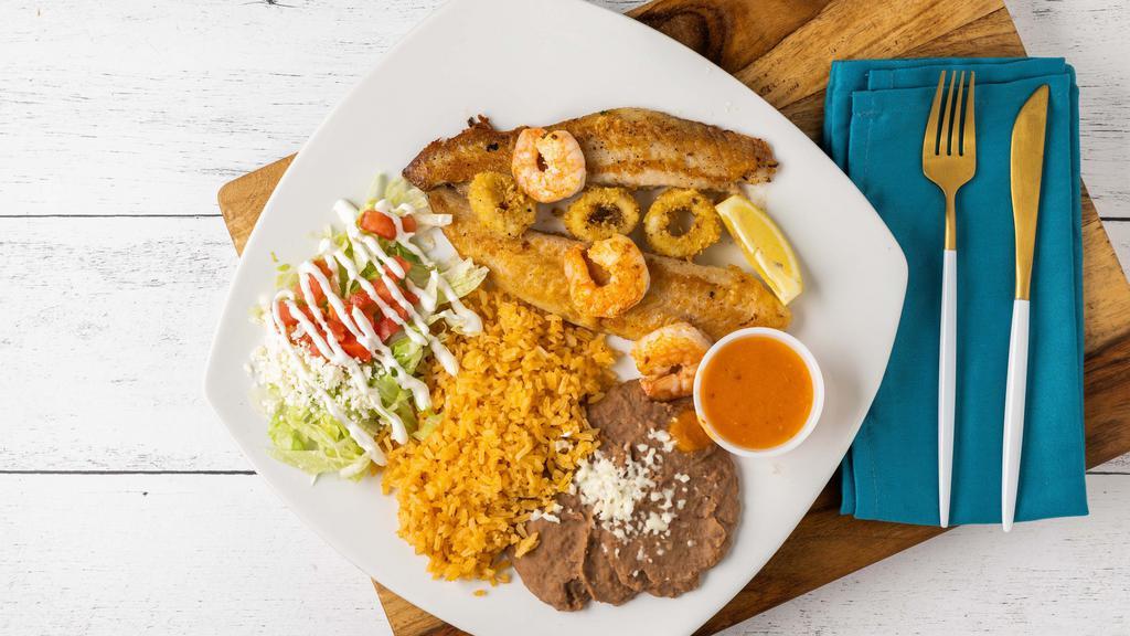 Platillo Del Mar · Flavorful grilled fish fillet topped with grilled shrimps and fried calamari.