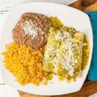Enchiladas Suizas · Three corn tortilla stuffed with grilled chicken and topped with cheese dip, tomatillo sauce...