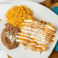 Enchiladas De Camarón (Shrimp) · Three corn tortilla stuffed with grilled shrimp and onions. Topped with chipotle salsa, ques...