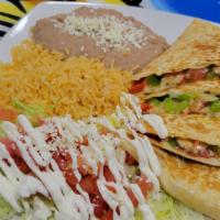Fajita Quesadilla · A flour tortilla stuffed with cheese, choice of protein and grilled onions, tomatoes, bell p...