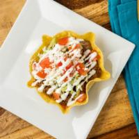 Tostadas · Ground Beef or shredded chicken Tostada. Flat crunchy tortilla topped with your choice of pr...