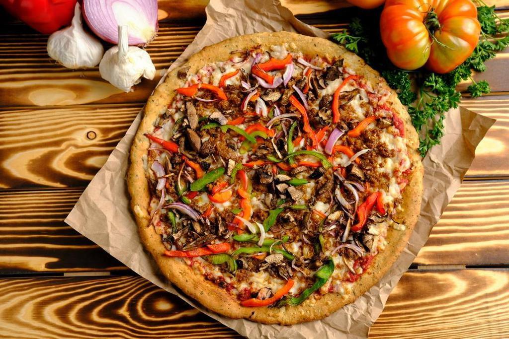 Philly Pizza · Roasted Basil Pizza Sauce, Vegan Mozzarella Cheese, Mild Beyond Sausage, Red Onions, Bell Peppers & Portabella Mushrooms.