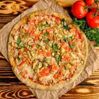 Spinach & Artichoke Pizza · Roasted Basil Pizza Sauce, Vegan Mozzarella Cheese, Spinach, Tomatoes & Artichokes.