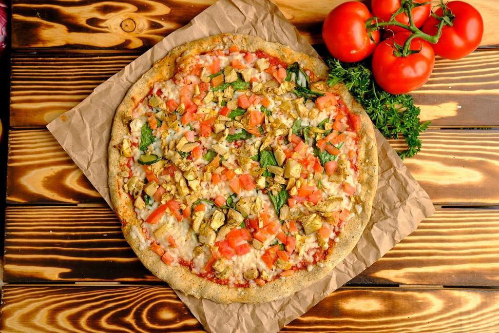 Spinach & Artichoke Pizza · Roasted Basil Pizza Sauce, Vegan Mozzarella Cheese, Spinach, Tomatoes & Artichokes.