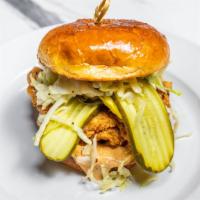 Fried Chicken Sandwich    · Crispy fried chicken, fresh slaw, dill pickles, potato medallions, and spicy remoulade sauce...