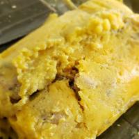 Tamal Solo Breakfast · Tamal filled with chicken, beef, potatoes, carrots and peas, wrapped in a banaba  leaf, cook...