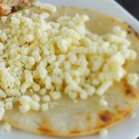 Arepa Con Queso · White corn bread with butter and cheese.