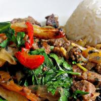 Lomo Saltado Peruano · Strips of sirloin marinated in vinegar, soy sauce and spices, then stir fried with onions, p...