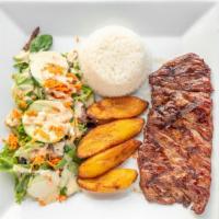 Carne Asada · Grilled steak. Served with rice, green or sweet plantains, and salad.