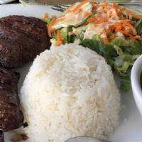 Mega Churrasco · Grilled churrasco skirt steak, rice, red beans, and salad.