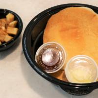 Drops Of Jupiter Fluffy Buttermilk Pancakes · 2 of our light and fluffy buttermilk pancakes topped with butter, served with syrup and a si...