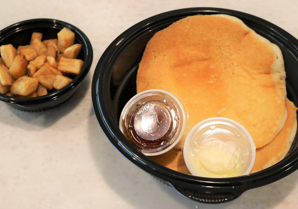 Drops Of Jupiter Fluffy Buttermilk Pancakes · 2 of our light and fluffy buttermilk pancakes topped with butter, served with syrup and a side.