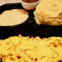 Smoked Salmon Scramble · 3 eggs scrambled with wood-smoked chopped salmon and dill cream cheese. Served with choice o...