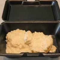 Gravy Biscuit · An open faced biscuit smothered in our chicken sausage gravy.