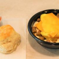 Sausage Grit Bowl · A 12 oz bowl of white cheddar cheese grits topped with scrambled egg, American cheese and ch...