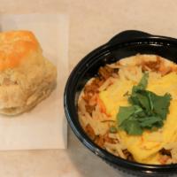 Chorizo Grit Bowl · A 12 oz bowl of white cheddar cheese grits topped with scrambled egg, American cheese, chick...