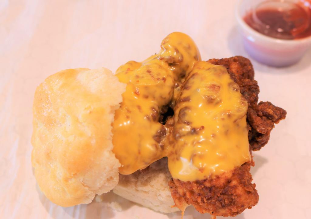Fried Chicken And Cheese Biscuit · Biscuit sandwich with 2 fried chicken tenders and American cheese.
