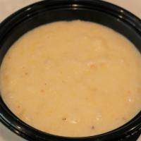 Grits · White cheddar cheese grits.