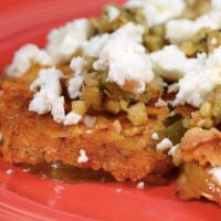 Fried Green Tomatoes · Classic Southern sliced green tomatoes seasoned with cornmeal and topped with house-made cas...