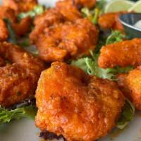 Buffalo Shrimp · Lightly breaded and tossed in sauce.