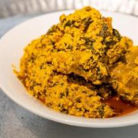 Egusi Soup · Ground melon seed, scotch bonnet pepper, and spices, meat assorted meat, and goat meat.