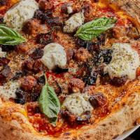 Domenica Pizza · Tomato sauce, mozzarella cheese, fried eggplant, mini meatballs and ricotta cheese.