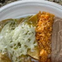 Enchiladas Suizas  · Three crispy rolled corn tortillas stuffed with chicken smothered with Salsa Verde and toppe...
