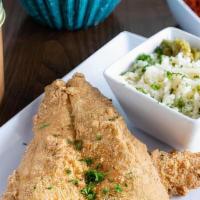 Fish And Grits · White fish fried crispy to perfection with house honey hot sauce and house grits.