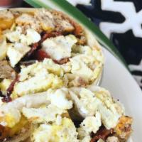 Breakfast Burrito · 12 in flour tortilla, eggs, potato, beans , chorizo and shredded cheese.