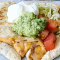 Quesadilla · Popular. 12 in flour tortilla grilled to order with choice of meat and cheddar cheese, serve...