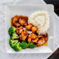 Orange Chicken · Battered white meat chicken chunk, deep fried and sauteed with broccoli and onion in orange ...