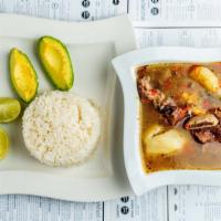 Sancocho De Costilla · A beef soup filled with an array of Caribbean spices with every spoonful. It centers on shor...
