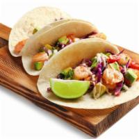 Mr Shrimp Tacos · Three corn tortilla tacos filled with juicy, grilled shrimp, red pickled onions, cilantro, c...