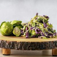 Slaw Of Brussels (Vegan) · Sauteed brussels sprouts 1/2 cut with house seasoning.