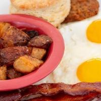 Southern Breakfast · Two eggs any style, stone ground grits, applewood-smoked bacon, buttermilk biscuit and a fri...