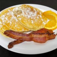 Classic Buttermilk Pancakes · Our Classic Buttermilk Pancakes topped with a scoop of cane syrup butter, served with applew...