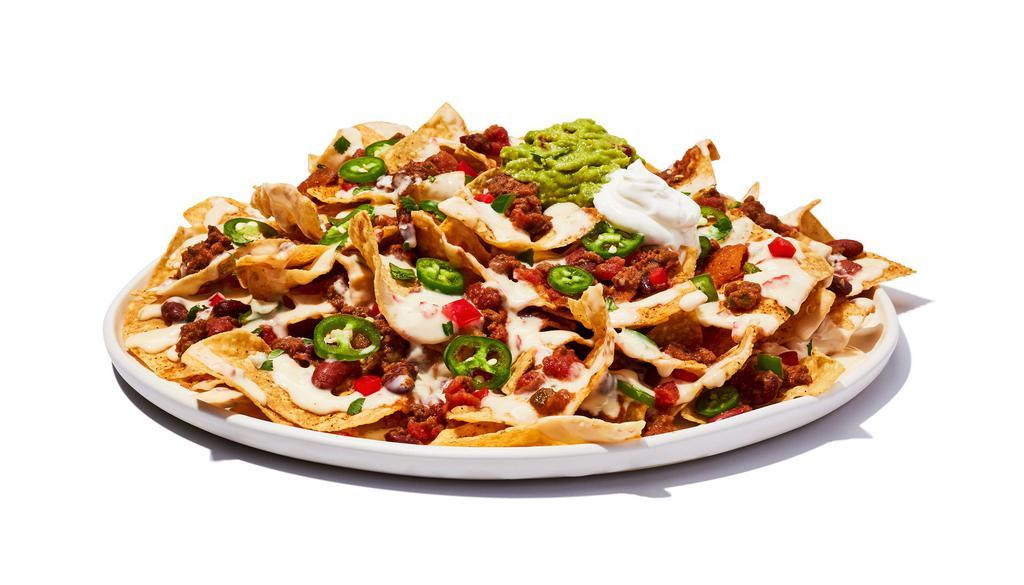 Tex Mex Nachos · Fresh chips loaded with gooey cheese and chili, piled high with fresh guacamole, lettuce, fresh pico de gallo, jalapeños, sour cream and our avocado ranch.