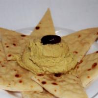 Hummus · Homemade ground chick pea spread served with pita bread.
