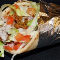 Falafel Pita Sandwich · Fried ground chickpeas with parsley topped with lettuce, tomato, onion and tahini sauce wrap...