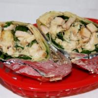 Chicken Caesar Wrap · Sliced grilled chicken breast, lettuce, Parmesan cheese, and caesar dressing in a warm flour...