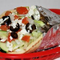 Vegetable Pita · Cucumbers, lettuce, tomatoes, onions, fried egg plant, black olives, and feta cheese with hu...