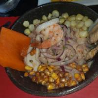 Cebiche Mixto Swai · SWAI + seafood cebiche.
seafood: squids, mussels, shrimps and octopus.