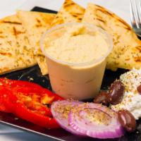 Hummus · It comes with grilled pita bread, feta, olives, peppers & onion.