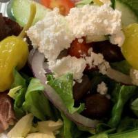 Greek Salad · Mixed greens, tomatoes, cucumbers, olives, onions, pepperoncini & feta cheese with a side of...