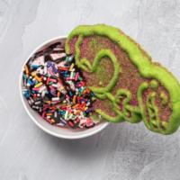 Kids Dino Sundae · Vanilla ice cream with chocolate syrup, rainbow sprinkles and a dinosaur sugar cookie.